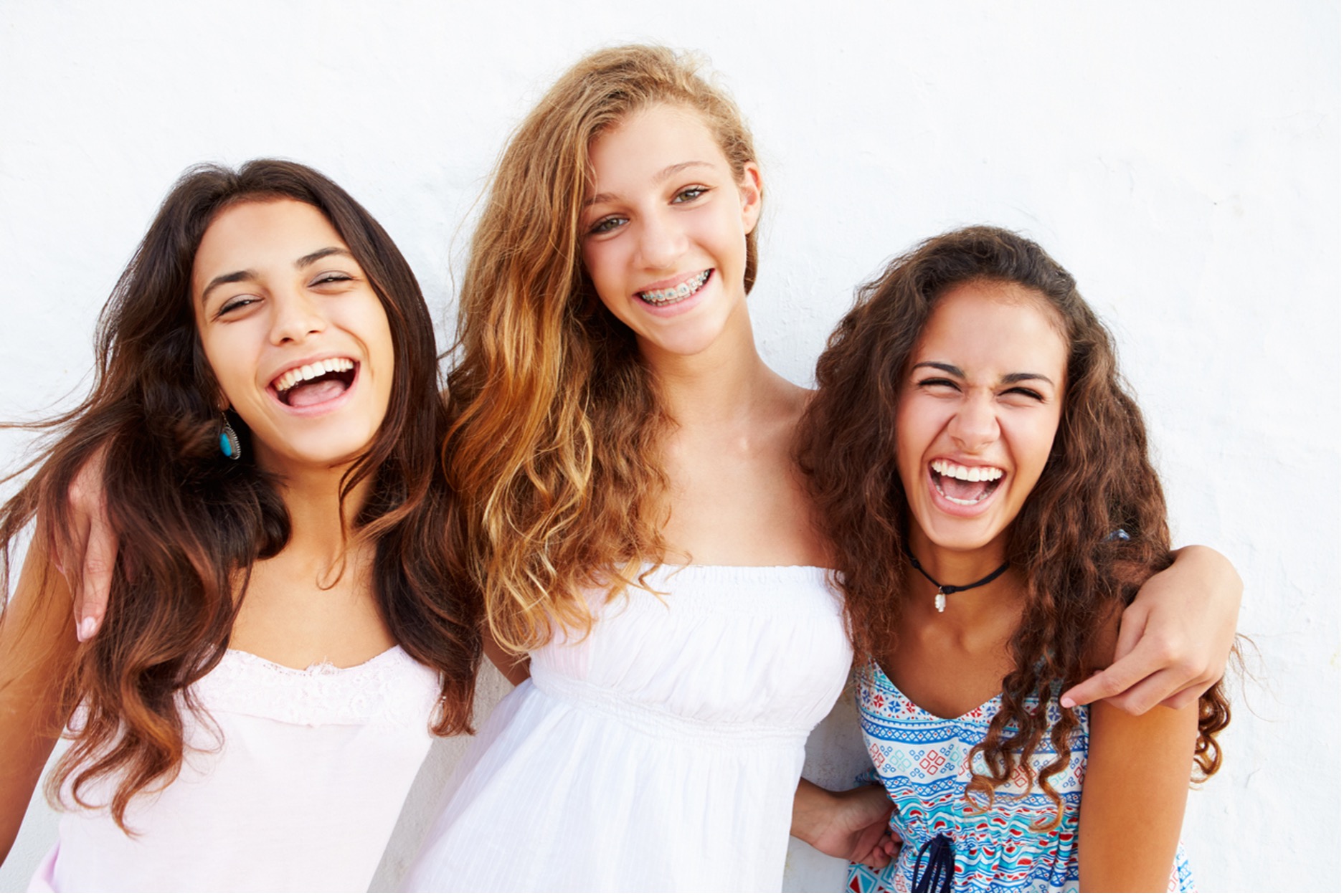 A group of girls smiling, Smile Smartly: Maximize Your FSA and HSA Benefits for Orthodontic Treatment!
