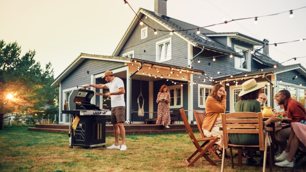 A group of people outside a house enjoying a BBQ, Summer Fun with Braces