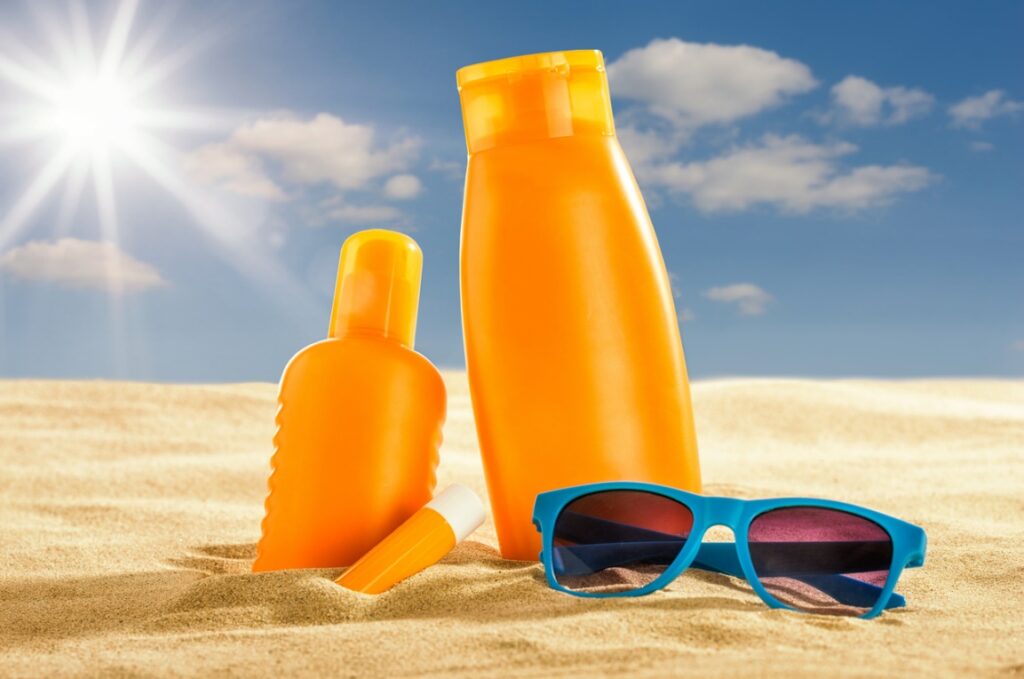 Sun protection products in the sand, Summer Fun with Braces