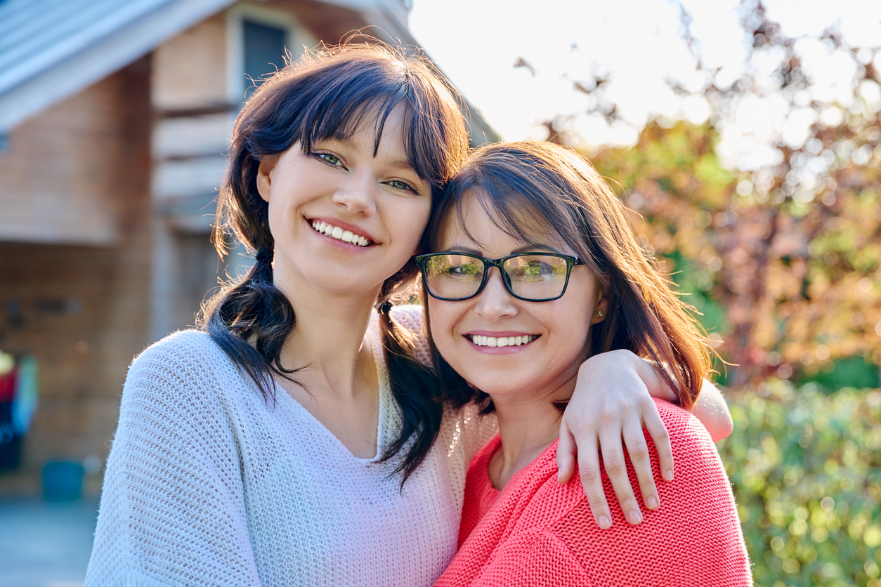 Two women smiling at the camera, Debunking Common Myths About Braces: What You Need to Know