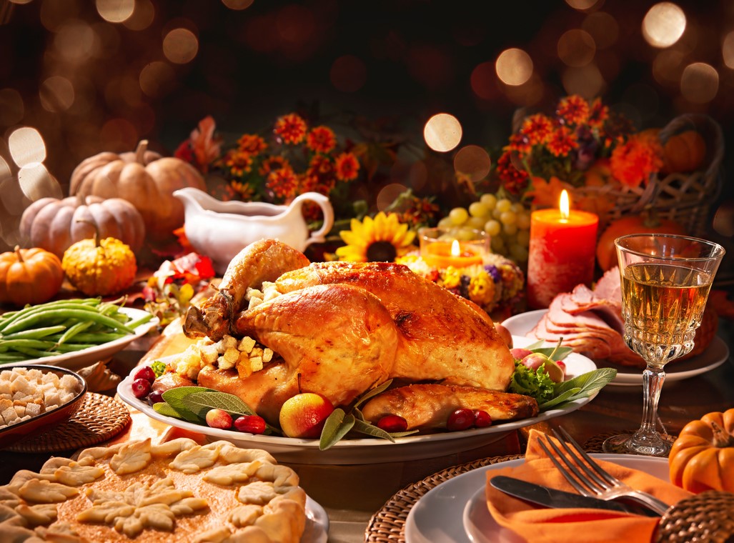 A table full of food, thanksgiving spread, Holiday Braces & Aligners Care: Keep Your Smile Safe During Festive Feasts