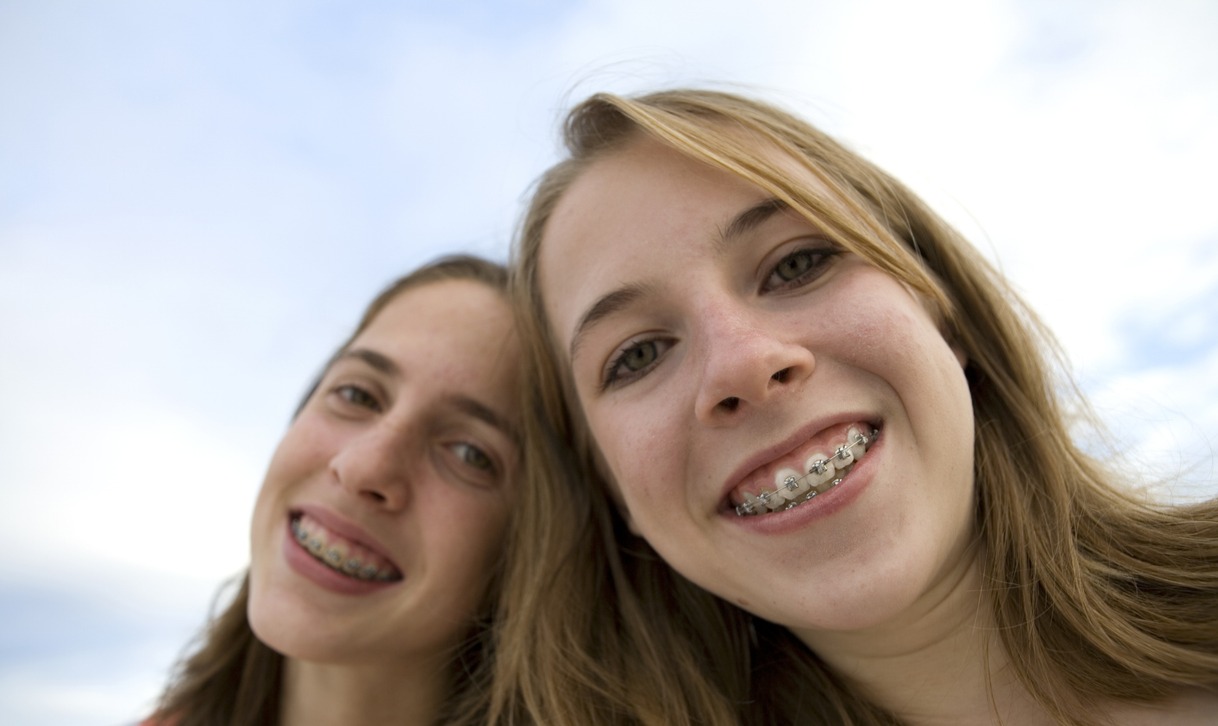 A couple of girls smiling, New Year, New Smile: Setting Orthodontic Goals for 2025